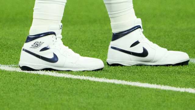 View of Dallas Cowboys quarterback Dak Prescott's white and blue Air Jordan cleats.